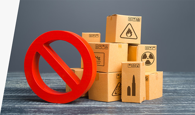 Brown boxes marked with symbols for ammunition, mercury, and radioactive and flammable items, next to a red circle with a slash through it.