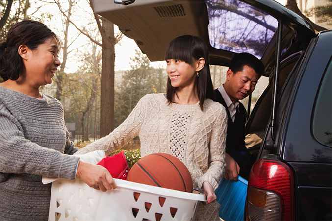 A family loading a car for a trip.